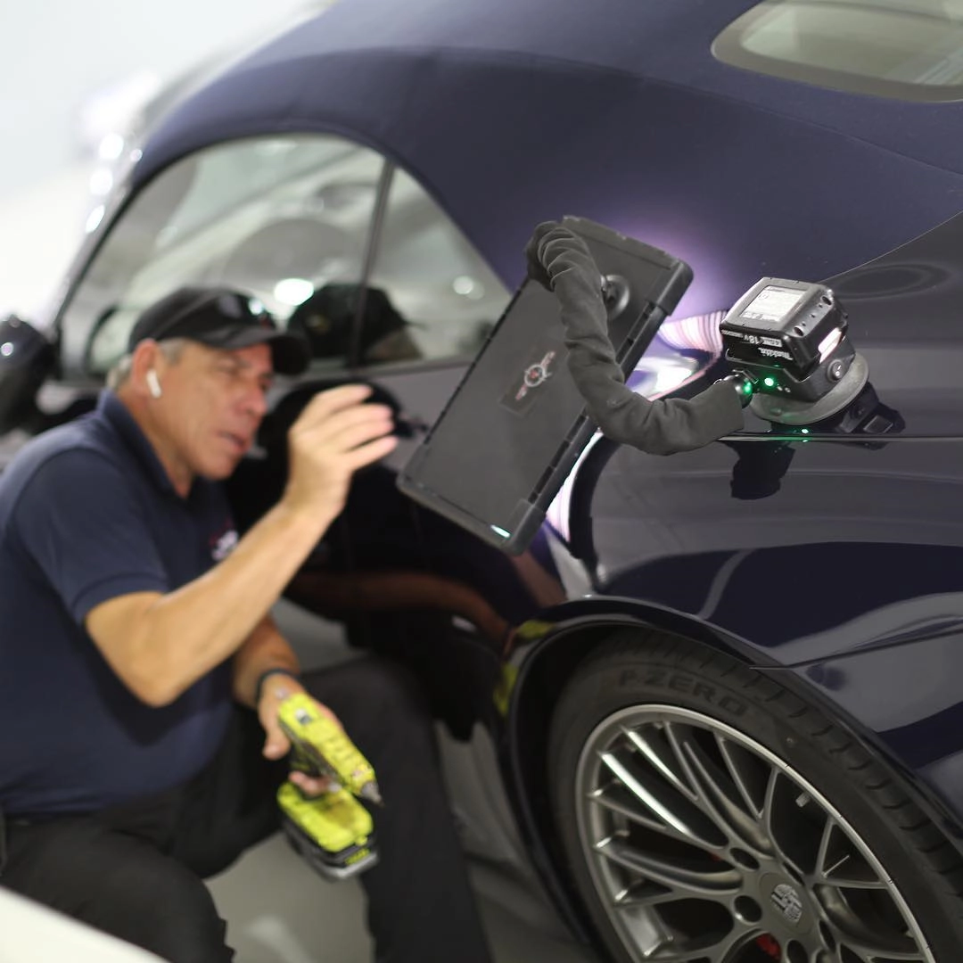 Hector fixing a dent